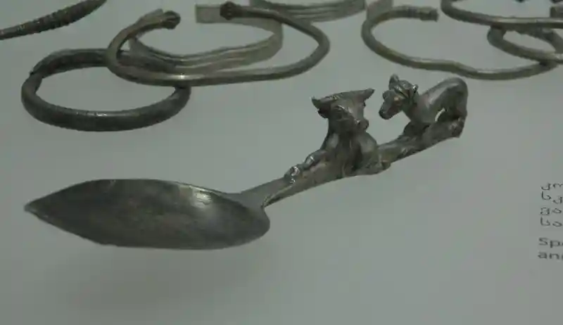 Spoon with sculptural representations of bull and dog